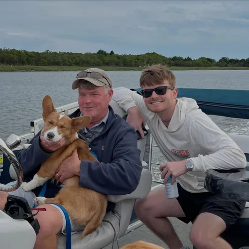 Noah with his dad and Oliver, out on the boat